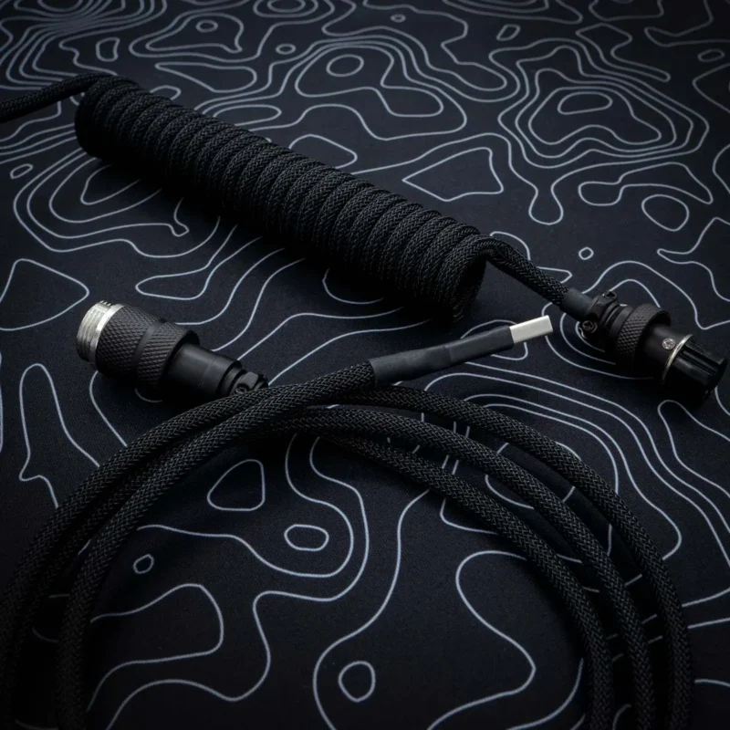 Black coiled cable Custom black keyboard cable featuring a coil section, USB connectors, and high-quality paracord braiding. Ideal for enhancing your setup.