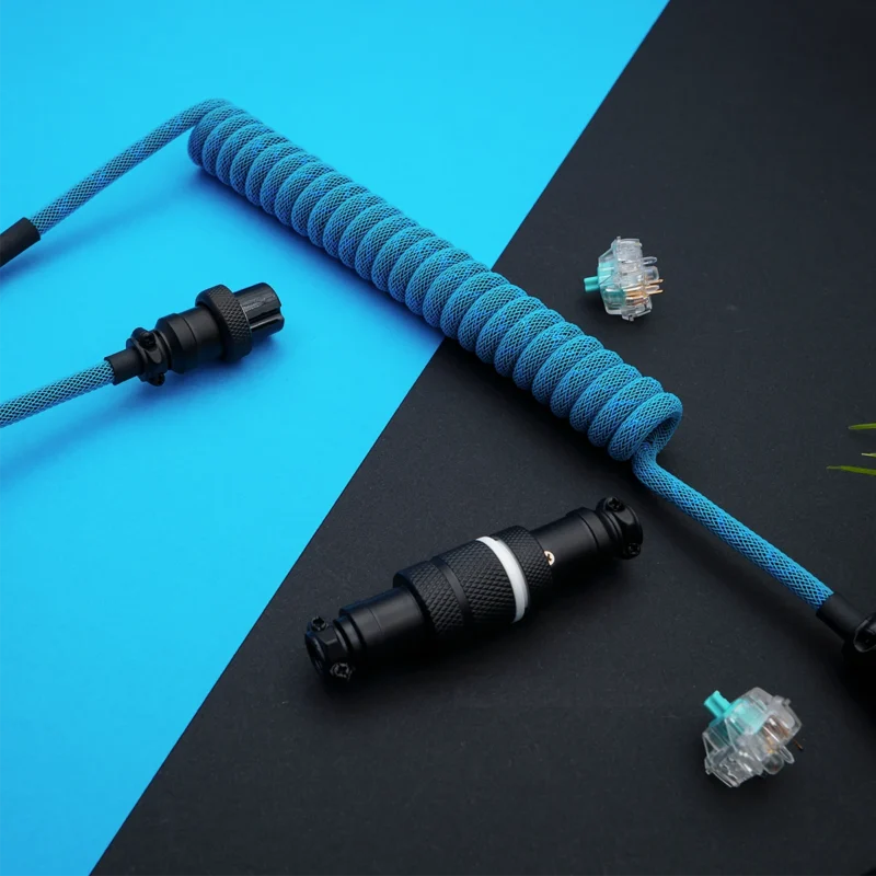 Blue coiled cable angled gx16 connector Custom keyboard cable with a vibrant blue coiled paracord, featuring detachable aviator and GX16 connectors, showcasing high-quality braiding and finish.