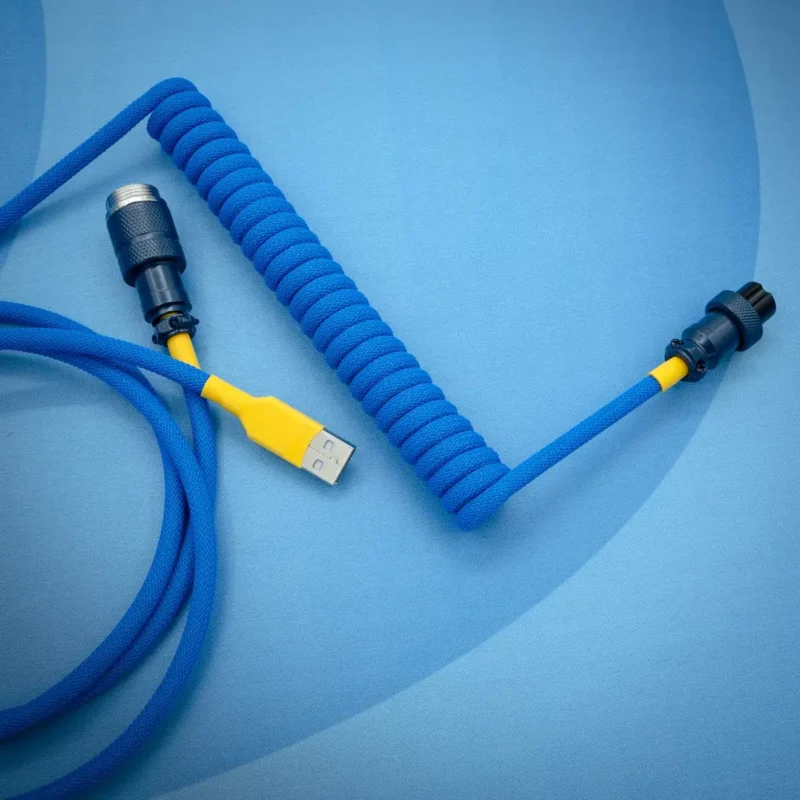 Blue coiled cable usb aviator top view Coiled blue keyboard cable with yellow accents