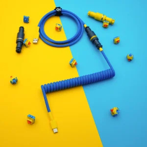 Blue yellow coiled cable usb c top view Bright blue custom keyboard cable featuring a coiled design