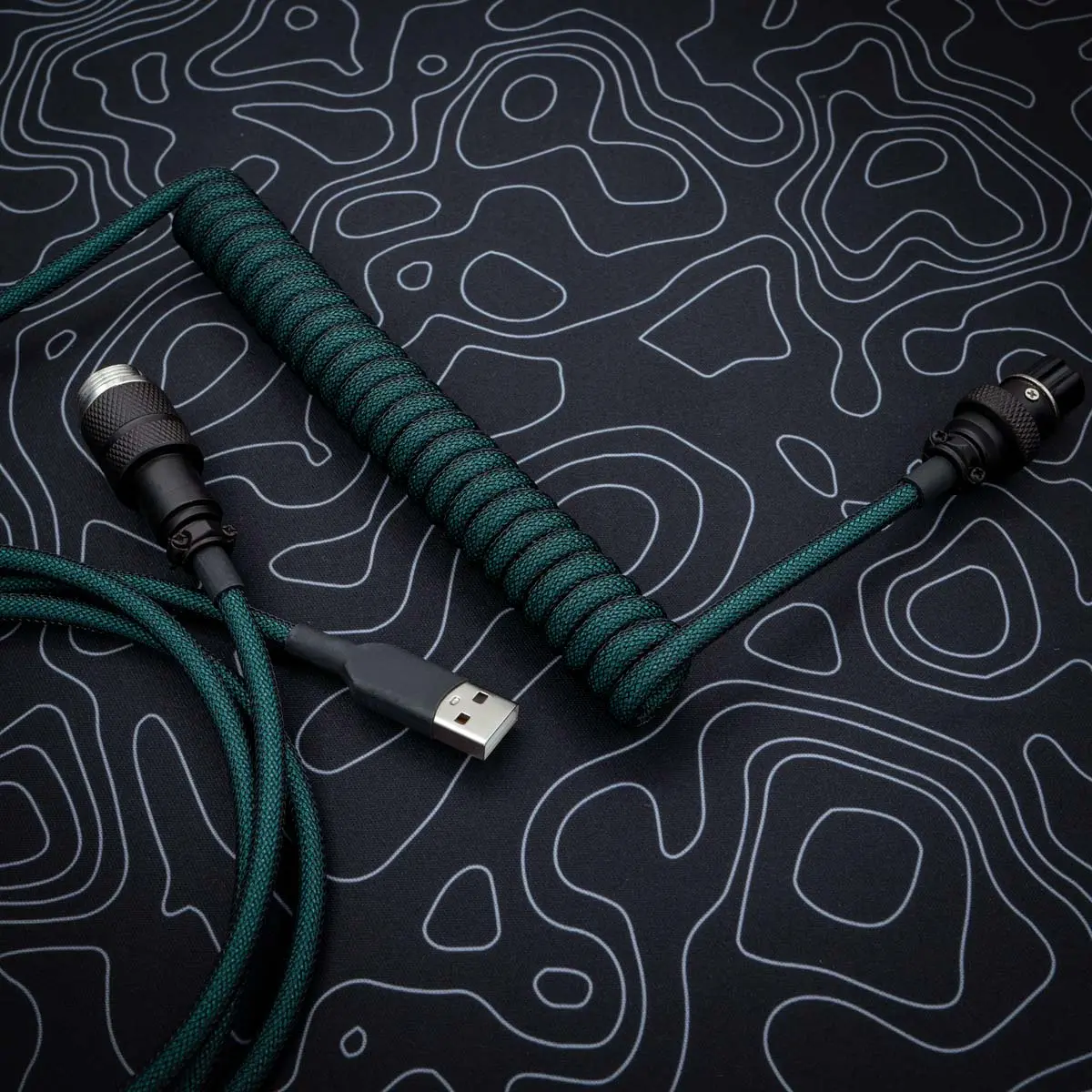 Dark green coiled cable usb aviator overhead Coiled green cable with USB-A connector