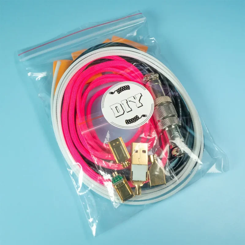 Diy usb kit compelt A clear plastic bag contains coiled pink paracord and white techflex, gold connectors, and electronic components labeled "DIY USB kit" on a blue background.