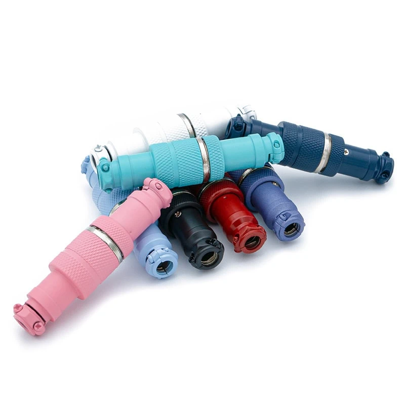 Gx16 aviator 4 pins connectors cerakoted A group of Aviator connectors each featuring a GX16 Connector 4 pins, are displayed in various colors, pink, blue, white, black, and red, arranged in a semi-circle on a white background.