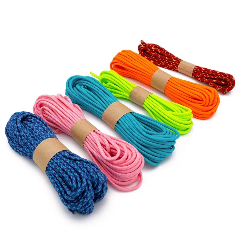 Paracord type iii 550 Five bundles of colorful 550 Paracord Genuine, each a different color : blue, pink, teal, neon yellow, orange, and patterned orange, perfect for crafting or a custom keyboard cable. Each bundle is neatly wrapped with paper bands.