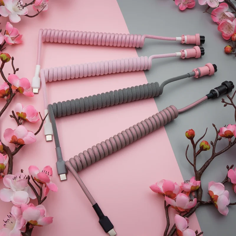 Pink gray coiled cables overhead sakura A stylish array of coiled keyboard cables in pink and gray