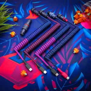 Purple blue coiled cable usb c closeup Custom keyboard cables showcasing vibrant paracord braiding in red