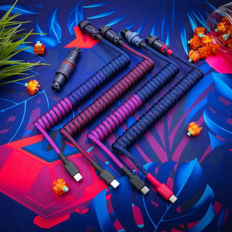 Purple blue coiled cable usb c closeup Custom keyboard cables showcasing vibrant paracord braiding in red