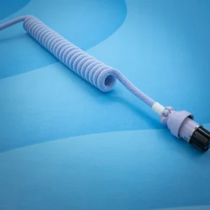 Purple coiled cable A delicate purple coiled keyboard cable with a smooth finish, featuring a sturdy aviator connector and detailed paracord braiding for durability.