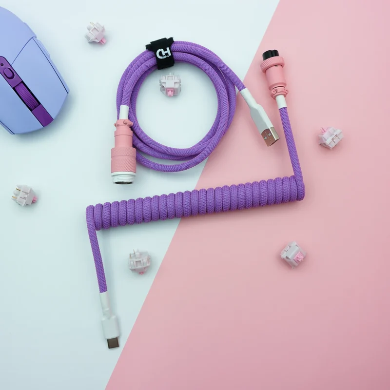 Purple coiled cable usb c overhead view Purple coiled keyboard cable featuring USB-C and aviator connectors