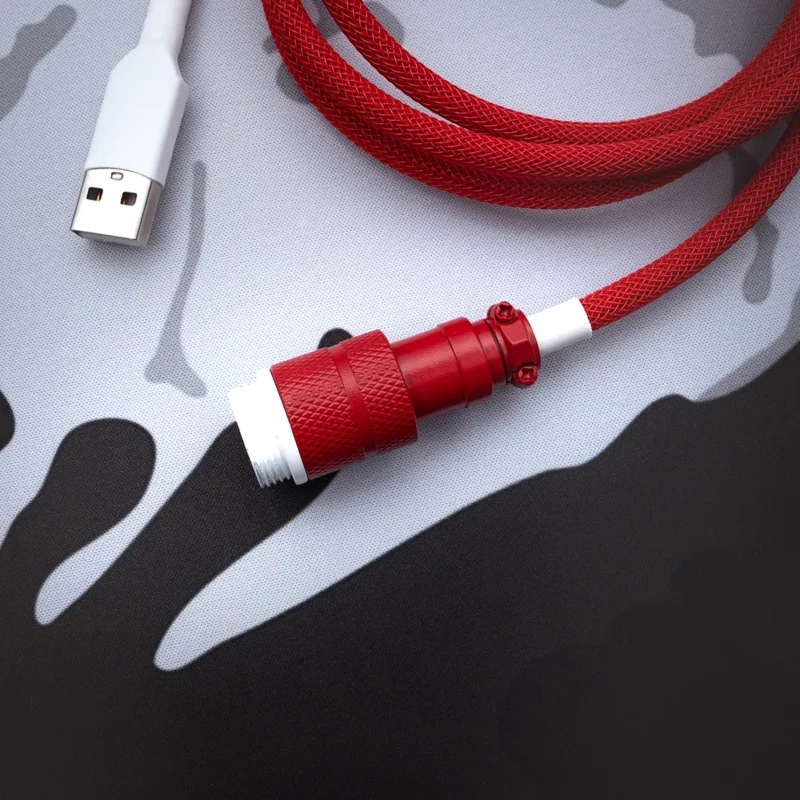 Red keyboard cable angled gx16 connector A vibrant red braided keyboard cable features a sturdy USB-C connector and a sleek detachable aviator plug, ensuring durability and style for your setup.