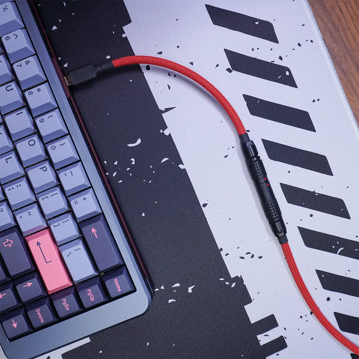 Red straight keyboard cable gmk jamon black lemo A mechanical keyboard with colorful keycaps sits on a black-and-white patterned desk mat, connected by a Red straight keyboard cable gmk jamon black lemo with a detachable connector.