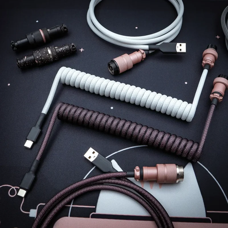 Rose gold pink coiled cables usb c top view Coiled and straight keyboard cables in light gray and dark purple