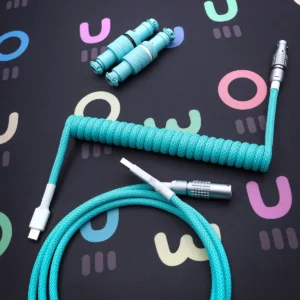 Teal coiled cable overhead lemo connectors A vibrant turquoise coiled keyboard cable featuring detachable USB-C and aviator connectors