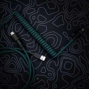 Teal coiled cable usb angled aviator Green coiled keyboard cable features a USB-C connector and a detachable aviator plug. The paracord texture enhances durability and style.