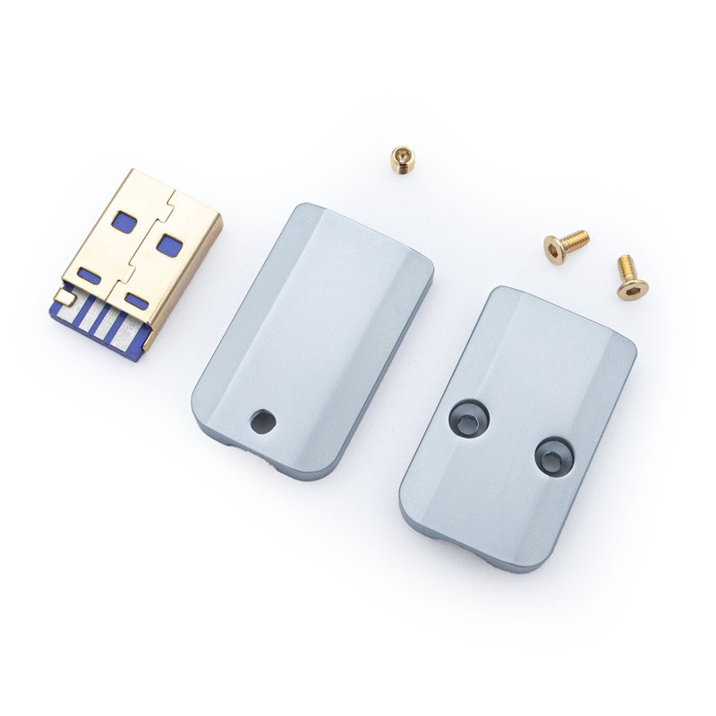 Usb a cnc connector silver v2 parts Disassembled USB device featuring a USB A connector, two silver USB A Housing CNC - V2 casing pieces, and three small screws on a white background.