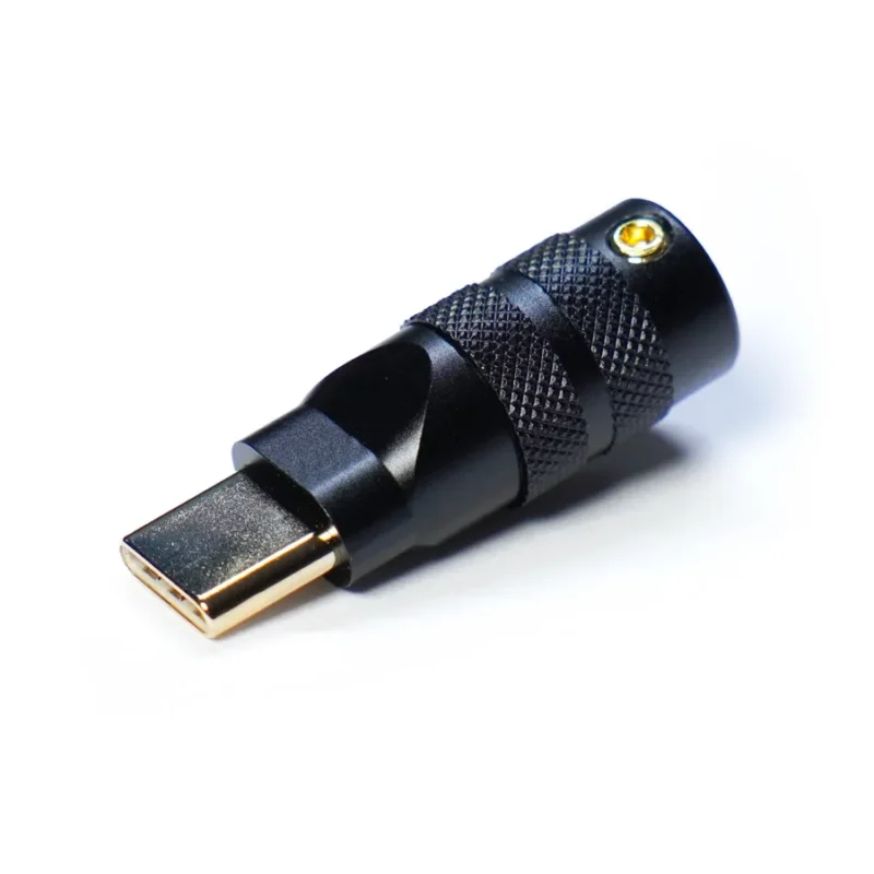 A close-up of a USB Type-C featuring a gold-plated connector and black textured metal housing CNC-machined for durability, placed on a white background.