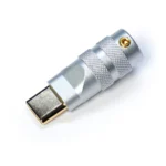 Usb type c connector housing cnc silver A close-up of a metallic USB Type C featuring silver Housing CNC precision, with a textured grip and a gold-plated connector, photographed on a light background.