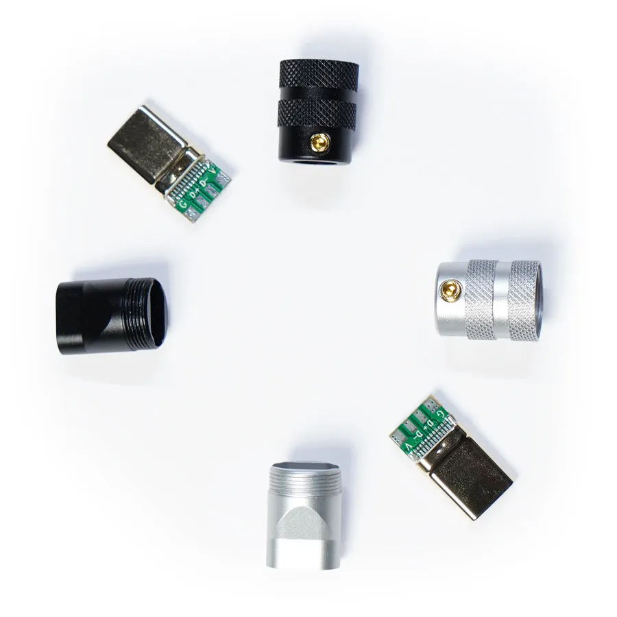 Usb typec housing cnc Six electronic components, including three metal cylinder connectors with USB Type C - Housing CNC features and three small circuit boards with USB 2.0 connectors, are arranged in a circular pattern on a white background.