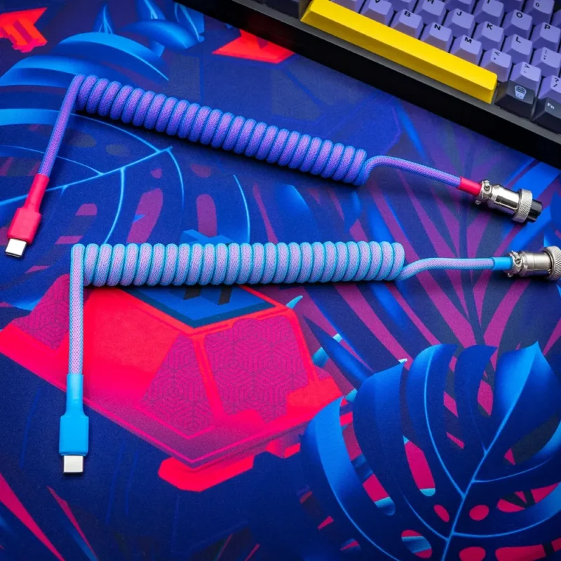 Vibrant coiled usb c cable top view Coiled GMK Vaporwave keyboard cable featuring USB-C connectors, vibrant blue and pink paracord, detachable aviator plug, and quality braiding.
