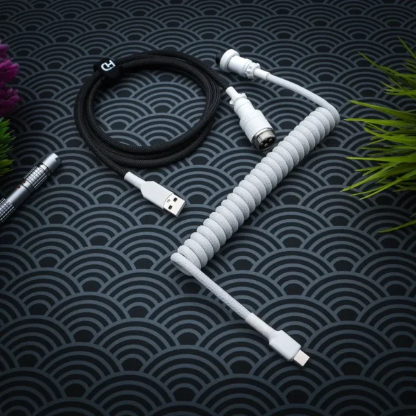 White black coiled cable overhead aviator usb Curled white paracord cable with USB-C and lemo connector, plus a black straight section, showcasing high-quality braiding and finish.