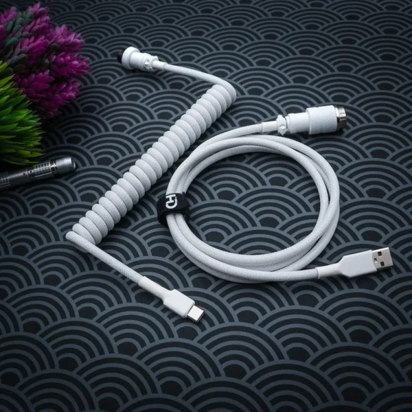 White coiled cable usb c top view pattern Custom GMK Wob Keyboard Cable in white with a coiled section and detachable USB-C and USB connectors. Features braided paracord for durability and style.