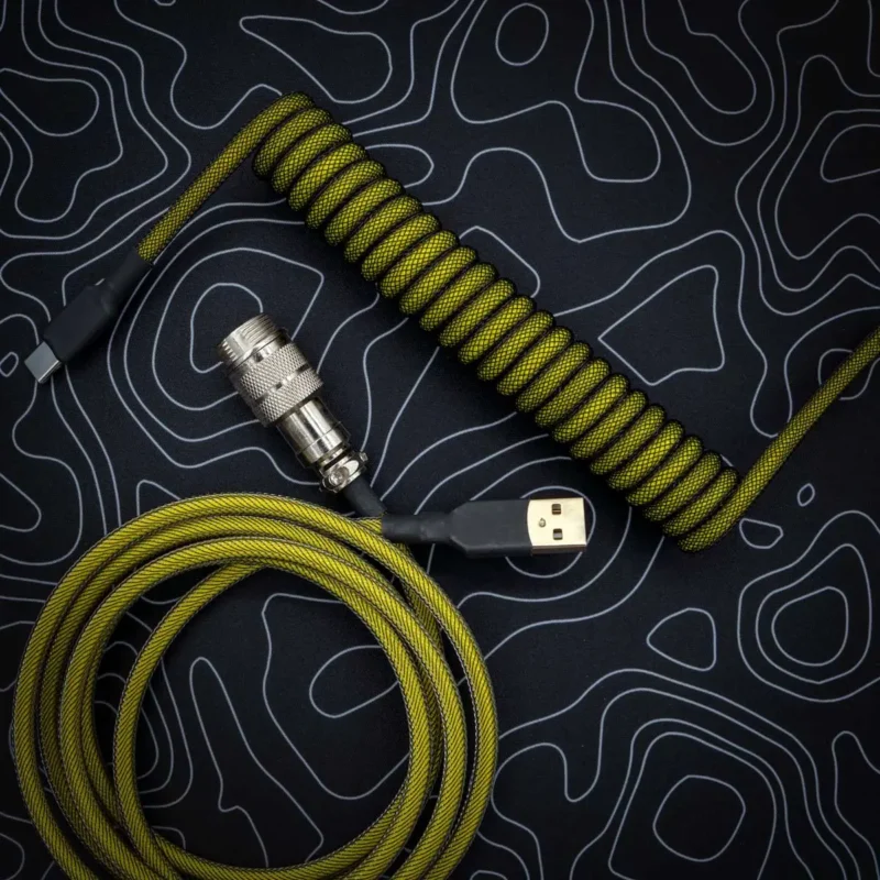 Yellow black coiled cable aviator top view Coiled yellow and black keyboard cable featuring USB-C and aviator connectors